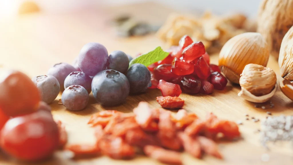 The best foods for healthy skin, hair, and nails including nuts, leafy greens, and fish.