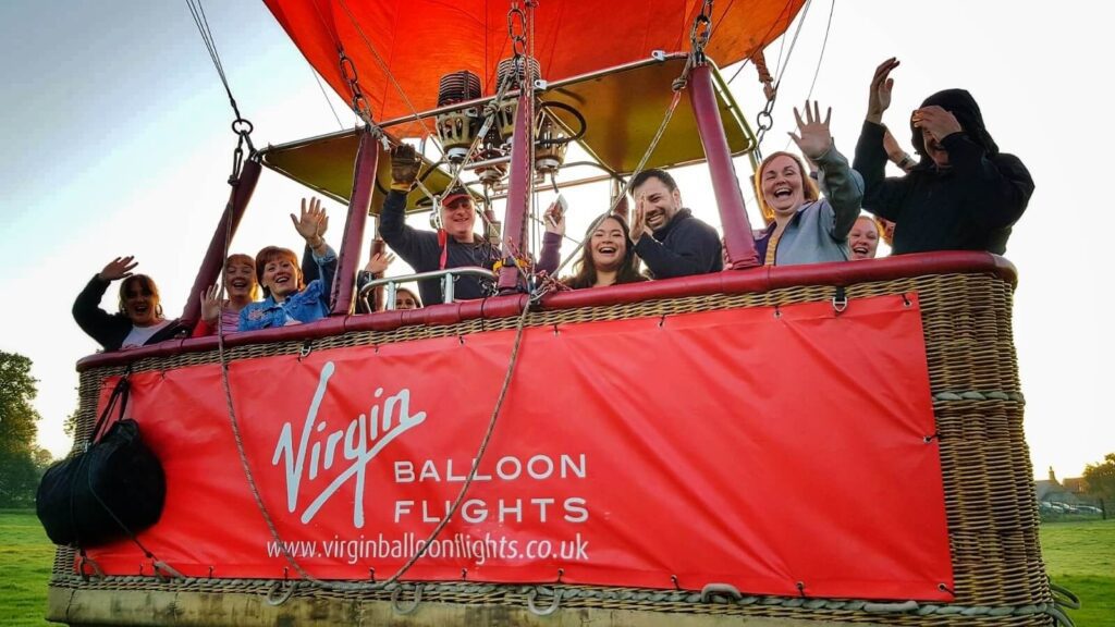 Hot air balloon soaring over scenic landscapes with Virgin Balloon Flights.