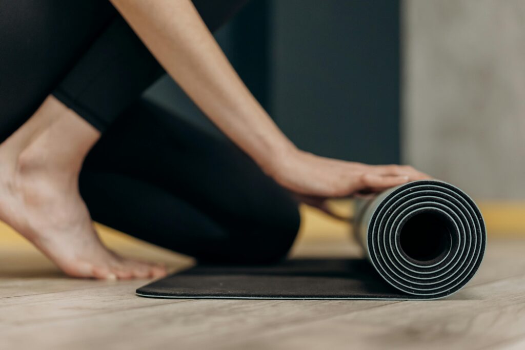 Woman practicing yoga as part of her personalized wellness routine for better health.